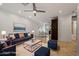 Stylish living room featuring a navy sofa, modern accents, an area rug, and plenty of natural light at 1850 E Maryland Ave # 18, Phoenix, AZ 85016