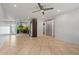 Bright living room featuring tile floors, modern lighting, and an open floor plan at 1850 E Maryland Ave # 18, Phoenix, AZ 85016