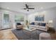 Bright living room featuring a plush sofa, soft armchairs, a glass-top coffee table, and tasteful decor at 1850 E Maryland Ave # 18, Phoenix, AZ 85016