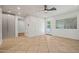 Bright, open living room with neutral tile flooring, ceiling fan, and modern finishes at 1850 E Maryland Ave # 18, Phoenix, AZ 85016