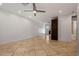 Bright living room featuring tile floors, modern lighting, and an open floor plan at 1850 E Maryland Ave # 18, Phoenix, AZ 85016