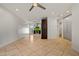 Bright living room featuring tile floors, modern lighting, and an open floor plan at 1850 E Maryland Ave # 18, Phoenix, AZ 85016
