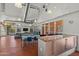 Bright lounge area with kitchen, table, seating and outdoor access at 1850 E Maryland Ave # 18, Phoenix, AZ 85016