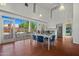 Bright lounge area features a dining table, kitchen, large windows, and access to a pool at 1850 E Maryland Ave # 18, Phoenix, AZ 85016