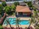 Aerial view of a community pool area with many lounge chairs and palm trees at 1850 E Maryland Ave # 18, Phoenix, AZ 85016
