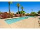 Community pool with palm trees and beautiful desert landscaping at 1850 E Maryland Ave # 18, Phoenix, AZ 85016