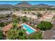 Aerial view of a community pool and landscaped grounds with Mountain Views at 1850 E Maryland Ave # 18, Phoenix, AZ 85016