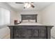 Main bedroom featuring a king-size bed and a ceiling fan at 18842 N Lakeforest Dr, Sun City, AZ 85373