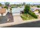 Charming home with a well-manicured front yard, two-car garage, and mature landscaping in a residential neighborhood at 19414 N 3Rd Ave, Phoenix, AZ 85027