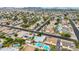 This aerial view showcases the neighborhood and the house with its beautiful swimming pool at 19414 N 3Rd Ave, Phoenix, AZ 85027