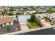 Residential home featuring a well-kept front yard, mature trees, and a two-car garage, situated in a quiet neighborhood at 19414 N 3Rd Ave, Phoenix, AZ 85027