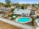 Beautiful backyard with refreshing pool, covered patio, lush greenery, and a cozy seating area perfect for entertaining at 19414 N 3Rd Ave, Phoenix, AZ 85027