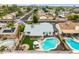 Beautiful backyard with refreshing pool, covered patio, lush greenery, and a cozy seating area perfect for entertaining at 19414 N 3Rd Ave, Phoenix, AZ 85027