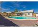 Inviting backyard with a pool, lounge chairs, dining table, and lush landscaping, perfect for outdoor living at 19414 N 3Rd Ave, Phoenix, AZ 85027