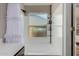 Bathroom featuring a shower-tub combo and a window at 19414 N 3Rd Ave, Phoenix, AZ 85027