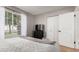 Bright bedroom with a full bed, window and a closet with double doors at 19414 N 3Rd Ave, Phoenix, AZ 85027