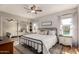 Bright bedroom with a view to the outdoor pool, modern decor, and mirrored closet at 19414 N 3Rd Ave, Phoenix, AZ 85027