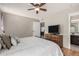 Bedroom with a full bed, an exit door, and a bathroom door at 19414 N 3Rd Ave, Phoenix, AZ 85027