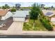 Charming home with well-maintained landscaping, inviting curb appeal, and a lovely green lawn at 19414 N 3Rd Ave, Phoenix, AZ 85027