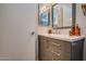 Modern bathroom with a gray vanity, white countertops, and neutral decor at 19849 N 33Rd Ave, Phoenix, AZ 85027
