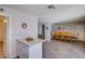 Open concept kitchen and dining area with tile floors and views to the living room at 19849 N 33Rd Ave, Phoenix, AZ 85027
