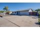 Charming home featuring desert landscaping, a spacious driveway, and an attached two-car garage at 19849 N 33Rd Ave, Phoenix, AZ 85027