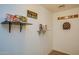 The game room area displays shelves filled with board games and wall decorations at 19849 N 33Rd Ave, Phoenix, AZ 85027