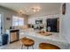 Bright kitchen featuring white cabinets, granite countertops, stainless appliances, and bar stool seating at 19849 N 33Rd Ave, Phoenix, AZ 85027