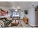 Bright living room with a large sectional sofa, rustic accents, and neutral walls at 19849 N 33Rd Ave, Phoenix, AZ 85027