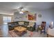 Comfortable living room with a large sofa, ceiling fan, and Southwest-inspired decor at 19849 N 33Rd Ave, Phoenix, AZ 85027
