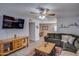 Inviting living room with a large screen TV, Southwest decor, and easy access to the dining area at 19849 N 33Rd Ave, Phoenix, AZ 85027