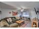 Spacious living room with a comfortable sofa, Southwest-themed decor, and plenty of natural light at 19849 N 33Rd Ave, Phoenix, AZ 85027