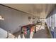 Long, enclosed patio featuring a foosball table and outdoor dining space at 19849 N 33Rd Ave, Phoenix, AZ 85027