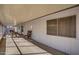 A covered porch that features a table with chairs and a lamp in a well-lit area with a window at 19849 N 33Rd Ave, Phoenix, AZ 85027
