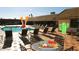 Community swimming pool with lounge chairs and tables under a sunny sky for relaxation and enjoyment at 201 S Greenfield Rd -- # 199, Mesa, AZ 85206