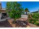 Well-maintained backyard with lush greenery, decorative rocks and patio at 201 S Greenfiled Rd -- # 199, Mesa, AZ 85206