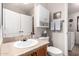 Well-lit bathroom with a single vanity, and convenient access to laundry at 201 S Greenfiled Rd -- # 199, Mesa, AZ 85206