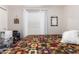 Cozy bedroom with a colorful quilt, natural light, and ample storage at 201 S Greenfiled Rd -- # 199, Mesa, AZ 85206