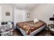 Cozy bedroom with a bed, side table, and storage containers at 201 S Greenfiled Rd -- # 199, Mesa, AZ 85206