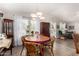 Bright dining room area featuring natural light, hardwood floors, and cozy furniture at 201 S Greenfiled Rd -- # 199, Mesa, AZ 85206