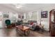 Inviting living room featuring hardwood floors, neutral paint, ceiling fan, and lots of natural light at 201 S Greenfiled Rd -- # 199, Mesa, AZ 85206