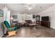 Cozy living room with hardwood floors, neutral paint, ceiling fan, and lots of natural light at 201 S Greenfiled Rd -- # 199, Mesa, AZ 85206