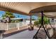Covered patio with outdoor furniture, pavers, and a manicured yard at 201 S Greenfiled Rd -- # 199, Mesa, AZ 85206