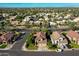 Expansive aerial view of a community with tree-lined streets and well-maintained homes at 2224 W Olive Way, Chandler, AZ 85248