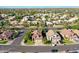 Aerial view of a residential street with various houses and mature landscaping at 2224 W Olive Way, Chandler, AZ 85248