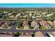 Scenic aerial view of a residential neighborhood with neatly arranged homes and green spaces at 2224 W Olive Way, Chandler, AZ 85248