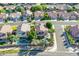 An aerial perspective showcasing several homes with pools and well-manicured yards at 2224 W Olive Way, Chandler, AZ 85248