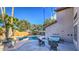 Beautiful backyard with a sparkling pool, comfortable seating, and lush landscaping under a sunny sky at 2224 W Olive Way, Chandler, AZ 85248