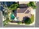 Aerial shot of backyard with a freeform pool, patio, and desert landscaping at 2224 W Olive Way, Chandler, AZ 85248