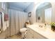 Cozy bathroom with shower-tub combination, neutral tones, and vanity with sink at 2224 W Olive Way, Chandler, AZ 85248